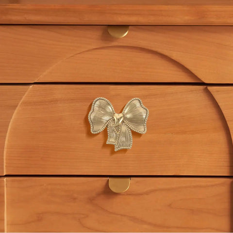 Luxurious Vintage Brass Bow Drawer Handles For Furniture And Boxes. Small Gold bowknot pull on wooden drawer front.
