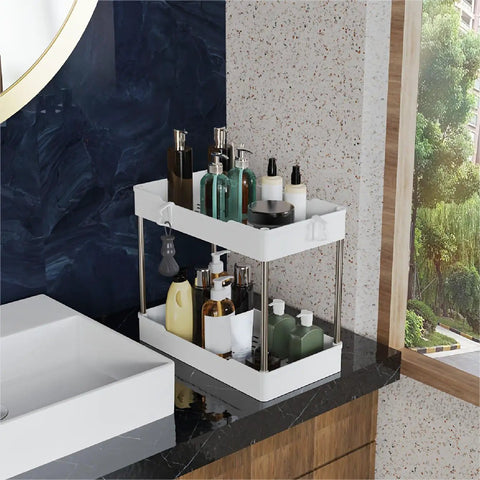 Super Slick 3 Pack Under Sink Organizer With Bonus Hanging Cups For Bathroom And Cabinet Storage keeps toiletries organized on a countertop.