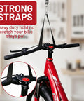 2 Pack Bike Ceiling Hoist Storage System for Garage Weight Lifting Gear 88 Pounds Capacity Heavy Duty Steel Pulley Rack Organizer with strong straps holding bike securely.