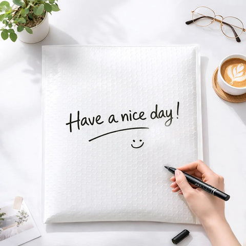 12x15 Inch Bubble Mailers 25 Pack Self Seal Padded Envelopes with 'Have a nice day!' message written on white surface