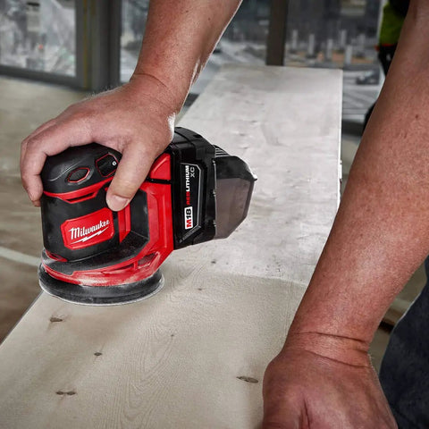 Slick Cordless Random Orbit Sander Kit With M18 Battery Pack for smooth wood finishing on a job site.