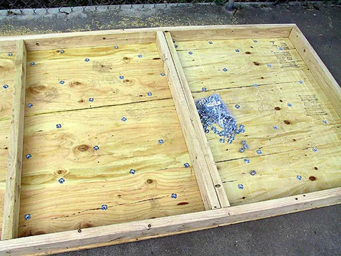 Wooden panel with Three Eighth Inch 16 T Nuts Pack Of 100 Zinc Plated Steel Tee Nuts inserted for woodworking projects
