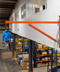 Heavy Duty Wall Mount Jib Crane Hoist Support Arm With 180 Degree Swinging Electric Scaffolding Lift Bracket All Steel Construction 660 Lbs Capacity For Industrial Garage Workshop Use Durable Steel Pole Holder holding a blue electric hoist.