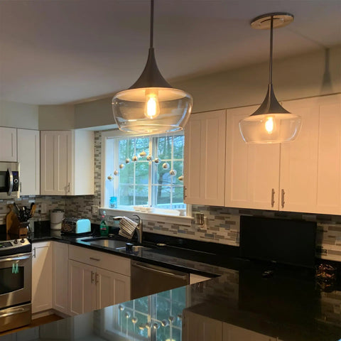 Kitchen with 13 Inch Modern Pendant Light With Clear Schoolhouse Glass Shade In Brushed Nickel Finish above island