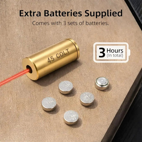 Top Tier.45 Colt And 12 Gauge Shotgun Laser Bore Sighter Cartridge showing laser output with extra batteries on wooden surface.