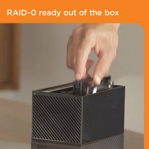 User inserting drives into the Ridiculous Capacity 20TB External Hard Drive Desktop RAID Rig for media storage.