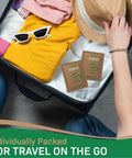 NOVEHA eyelid and lash wipe sachets with tea tree and coconut oil; travel-friendly, 2-pack shown in suitcase
