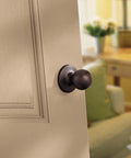 Polo Interior Passage Door Knob For Closet And Hallway Doors, Non Locking Doorknob In Satin Nickel With Microban Protection, Easy Do It Yourself Install, Ideal For Doors That Do Not Require Locks shown on wooden door.