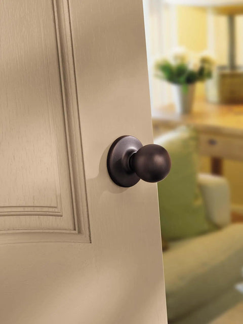 Polo Interior Passage Door Knob For Closet And Hallway Doors, Non Locking Doorknob In Satin Nickel With Microban Protection, Easy Do It Yourself Install, Ideal For Doors That Do Not Require Locks shown on wooden door.