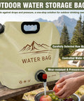 Outdoor water storage bag with mountain design, hand filling a bottle, wear-resistant material, on outdoor table.