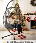 Outdoor Hanging Egg Chair With Stand Wicker Rattan Swing Chair in living room with Christmas decorations and people sitting