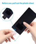 Hand removing plastic sheet from Two Pack 44 Key IR Remote Control For RGB LED Strip Lights Compatible With SMD 5050 3528 2835.
