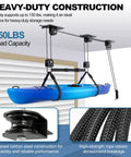 Beefy Cargo Box Ceiling Hoist With 3 Pulleys lifting kayak, heavy duty system holds up to 150 lbs, installed in garage ceiling.