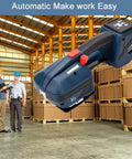Kickstart Your Packaging Hustle With This Badass 4000mah Battery Powered Strapping Tool in warehouse setting with boxes.