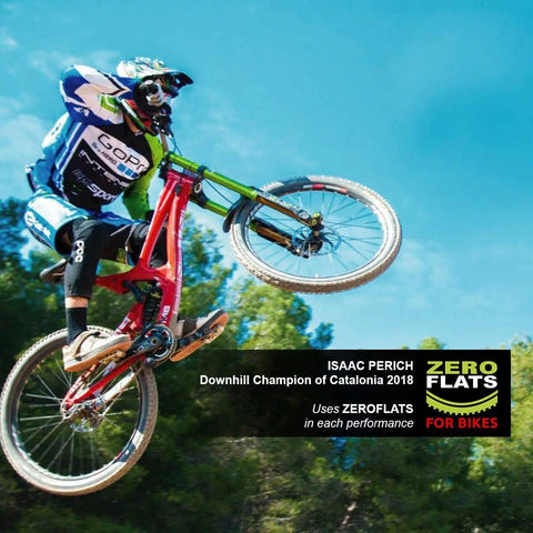 Mountain biker mid-air using Anti-Puncture Bike Tire Sealant, 8.45oz, Ultra-Fast Liquid For Standard, Tubeless And Tubular Tires.
