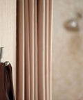 Brushed Nickel Double Robe Hook For Bathroom And Kitchen Walls A Durable Wall Mounted Metal Towel Hanger on beige wall with drape