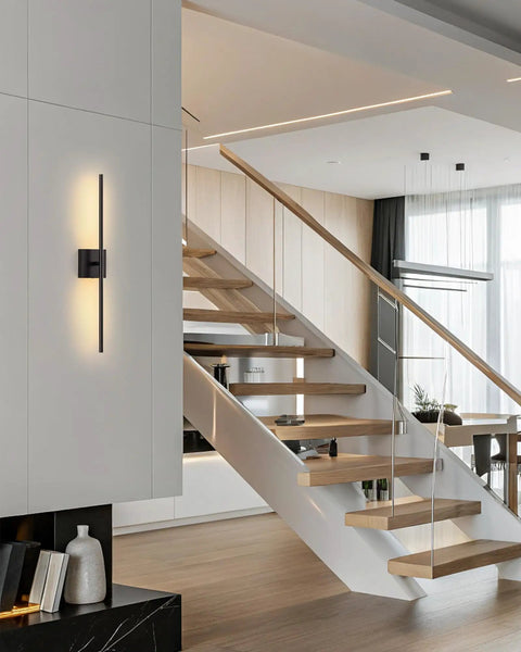 Slick Black Cordless Wall Sconces Set Of Two Wireless Led Accent Lamps With Smooth Stepless Dimming And Handy Remote Zero Wiring Hassle Modern Lighting For Bedrooms Hallways shown beside modern staircase.