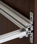 Built Tough Heavy Duty Aluminum Shelf Brackets Set for 202, 3030 and 4040 Corner Fittings mounted on wooden surface