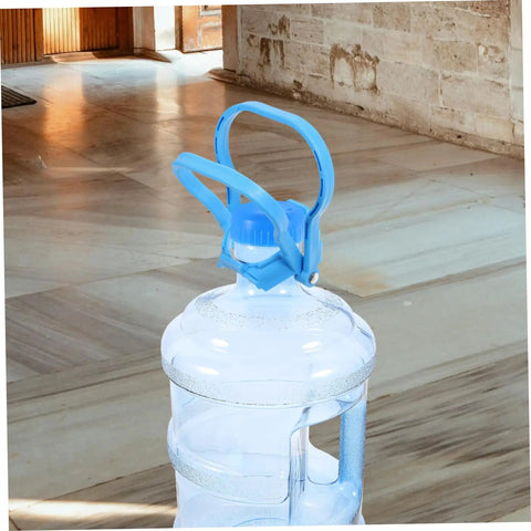 Close-up of blue ergonomic Gallon Water Bottle Handles 4 Pack Ergonomic Water Jug Lifters Carrier To Haul Heavy 5 Gallon Bottles Easy Transport For Home Office Stations And Everyday Use on top of a gallon bottle indoors.