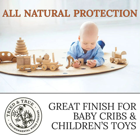 Baby playing with wooden toys on mat, promoting Danish Oil Wood Finish For Furniture And Rustic Pieces, Fast Curing Primer, Pure Polymerized Linseed Oil.