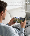 Person using 2-In-1 Holder Charger Cable With Stand, 240W PD Fast USB-C To USB-C And Lightning Cable while gaming on couch.