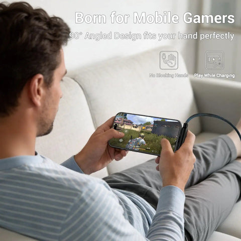 Person using 2-In-1 Holder Charger Cable With Stand, 240W PD Fast USB-C To USB-C And Lightning Cable while gaming on couch.