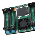 Straight Up Battery Diagnostics With This 4 Channel Capacity Tester Module Featuring Integrated Charge Discharge Functions For Li Ion Li Po Cells display with battery slots, cooling fan, and control buttons on a green PCB.
