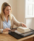 Woman organizing desk with Beefy Heavy Duty Metal Mesh Desk Organizer Tray for A4 files, black wire, large capacity, 12.6 x 9.1 x 2.8 inches.