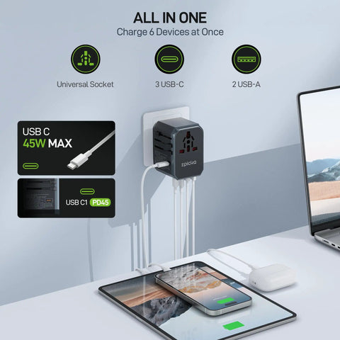GaN 45W Universal Travel Adapter With PD and QC Fast Charging, Two USB A Ports and Three USB C Ports in use on a desk.