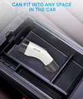 Tesla J1772 EV Charger Adapter Up To 60A 250V IP65 Weatherproof NACS To J1772 Converter shown in car storage compartment