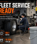 Mechanic using 50 To 1 Air Operated Grease Pump Kit With 7500 PSI High Pressure Delivery on truck for industrial maintenance