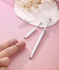 Pro Grade All In One Piercing Taper And Ball Grabber Tool Set 14G Through 20G for jewelry insertion and change on pink background