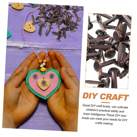 Hands holding a heart craft with Fifty Piece Double Foot Spikes Metal Brads For Scrapbooking And DIY Crafts Durable Paper Fasteners