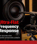 ECM999 Measurement Microphone For Room Calibration And Audio Testing Gear positioned in front of a speaker for sound analysis