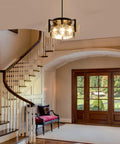 Get The Low On This Badass Matte Black 4 Light Adjustable Chandelier With Metal Frame To Drop Some Serious Glow Over Dining Tables Kitchen Islands Bedrooms Or Bathrooms Today in entryway with staircase.