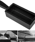 Cast-iron rectangular ingot mold with a handle; black loaf-style mold for melting and pouring metals
