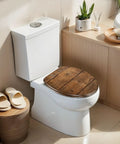 Elongated Overhead view brown wooden table Toilet Seat on modern toilet with white tank and wooden decor.