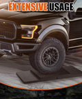 Truck parked on Universal Twelve Inch RV Stabilizer Jack Pads Rubber Non Slip Flex Blocks preventing sinking on uneven ground.