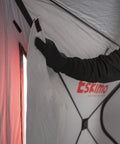 Hand adjusting the insulated interior of the Heavy Duty Pop Up Insulated Ice Fishing Shelter With Knockout Spacious Fishin Spot For Five To Seven Crews.