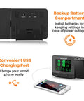 Digital Projection Alarm Clock With Weather Station And Indoor Outdoor Thermometer For Bedrooms USB Charger AC Or Battery Powered Bedroom Friendly All In One Time And Temperature Projection showing backup battery compartment and USB port charging a phone.