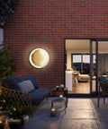 Moonlit Outdoor Wall Light 15.8 Inch Round Modern LED Exterior Waterproof Sconce illuminates patio with warm glow.