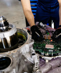 Technician assembling low speed synchronous motor AC 100 to 127 volt 50 60 hertz super slow 4 to 4.8 RPM clockwise counterclockwise 4 watt