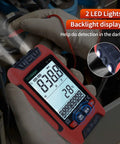 Digital Multimeter With TRMS And 9999 Counts Auto Ranging Backlight Display in use, showing backlight and LED light in dark environment