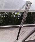 Solar Powered Greenhouse Window Opener, Heat Sensitive Auto Vent Kit with two springs and aluminum frame installed on greenhouse.