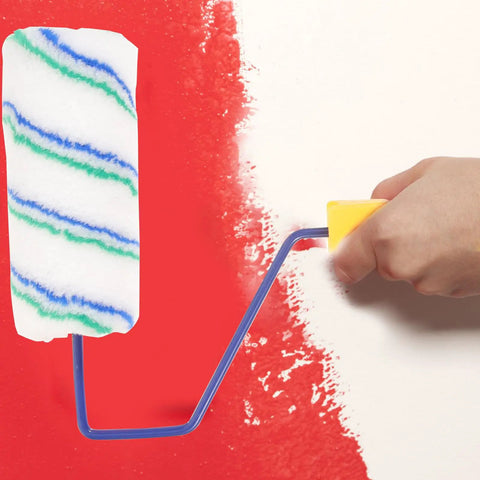 Portable Handheld Paint Roller With Removable Handle For Walls Ceilings And Furniture Lightweight Build, applying red paint with foam cover.