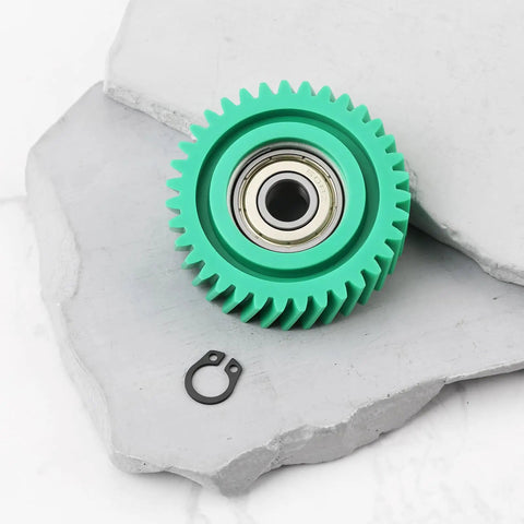 Close-up of a green gear from 3-Pack Oblique Nylon Motor Gear Set For 500W E-Bike Hub Motor, bearing visible