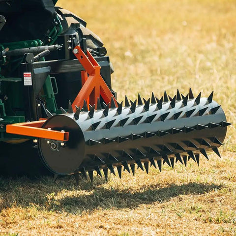 Six Foot Drum Spike Aerator For 3 Point Hitch On Cat 1 And Cat 2 Tractors, shown on grass field with spikes visible, ready for use.