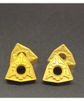 Top Rated 10 Pcs Carbide Turning Indexable Inserts For External Lathe Tools Includes WNMG080404 And WNMG080408 Grades With T9125 Material For Heavy Milling Jobs That Last Super Long Plus Easy Storage Box Included. Four yellow triangular carbide inserts on a dark background.