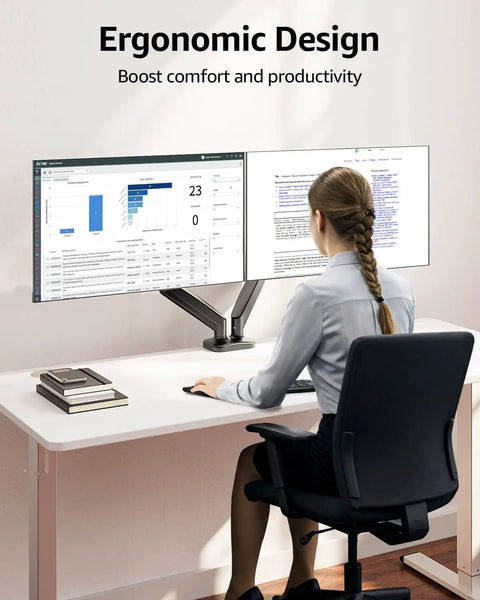 Woman using dual monitor desk arm mount for 22 to 32 inch screens height adjustable VESA 75x75 or 100x100 at ergonomic desk