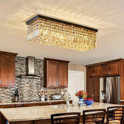 Showstopping Five Light K9 Crystal Chandelier Pendant Ceiling Light With Island Design over a kitchen island.